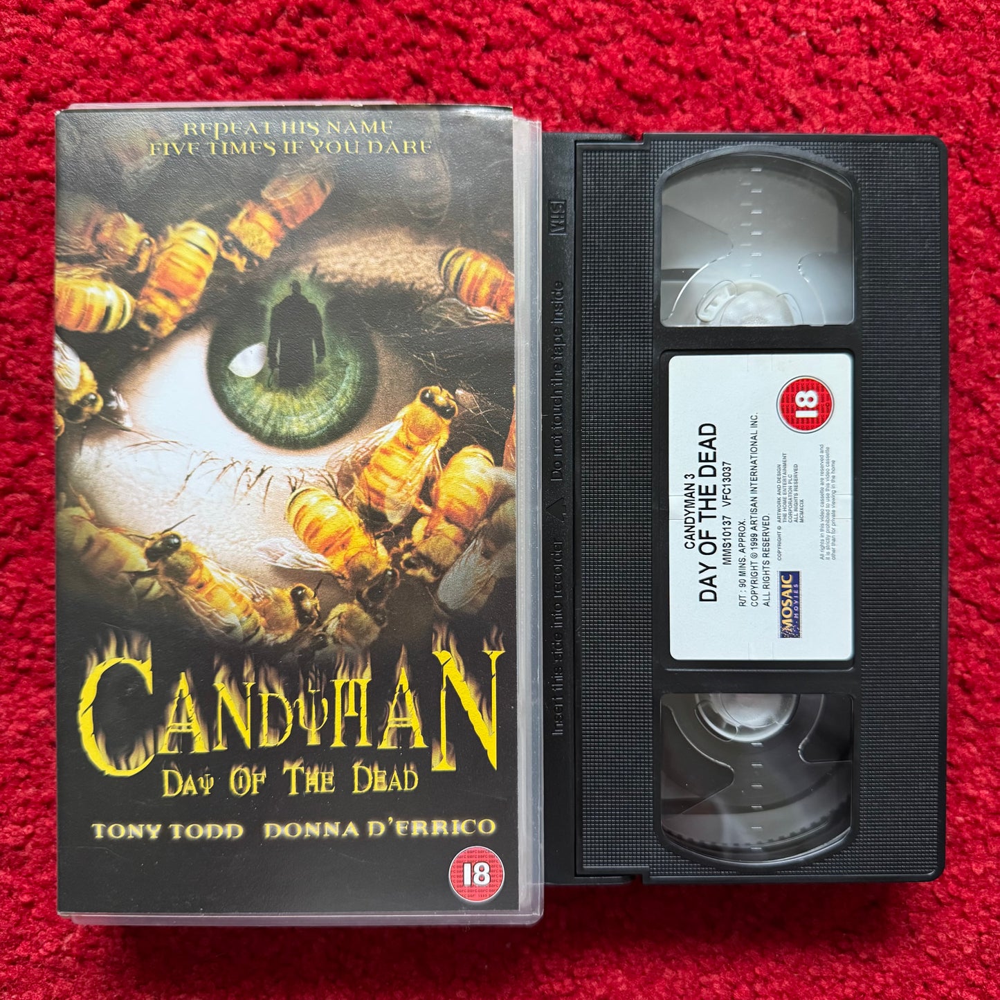 VHS tape of 'Candeman: Day of the Dead' with cover on a red background