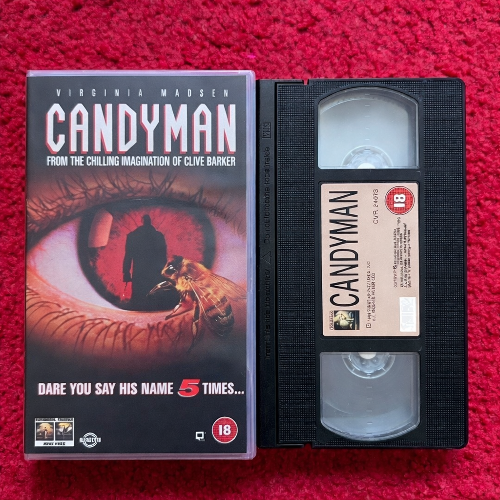VHS tape of 'Candyman' with cover on a red background