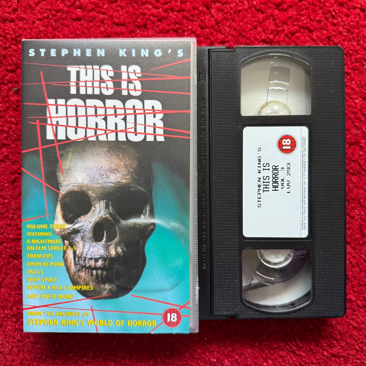 VHS tape and cover of 'Stephen King's This is Horror' on a red background