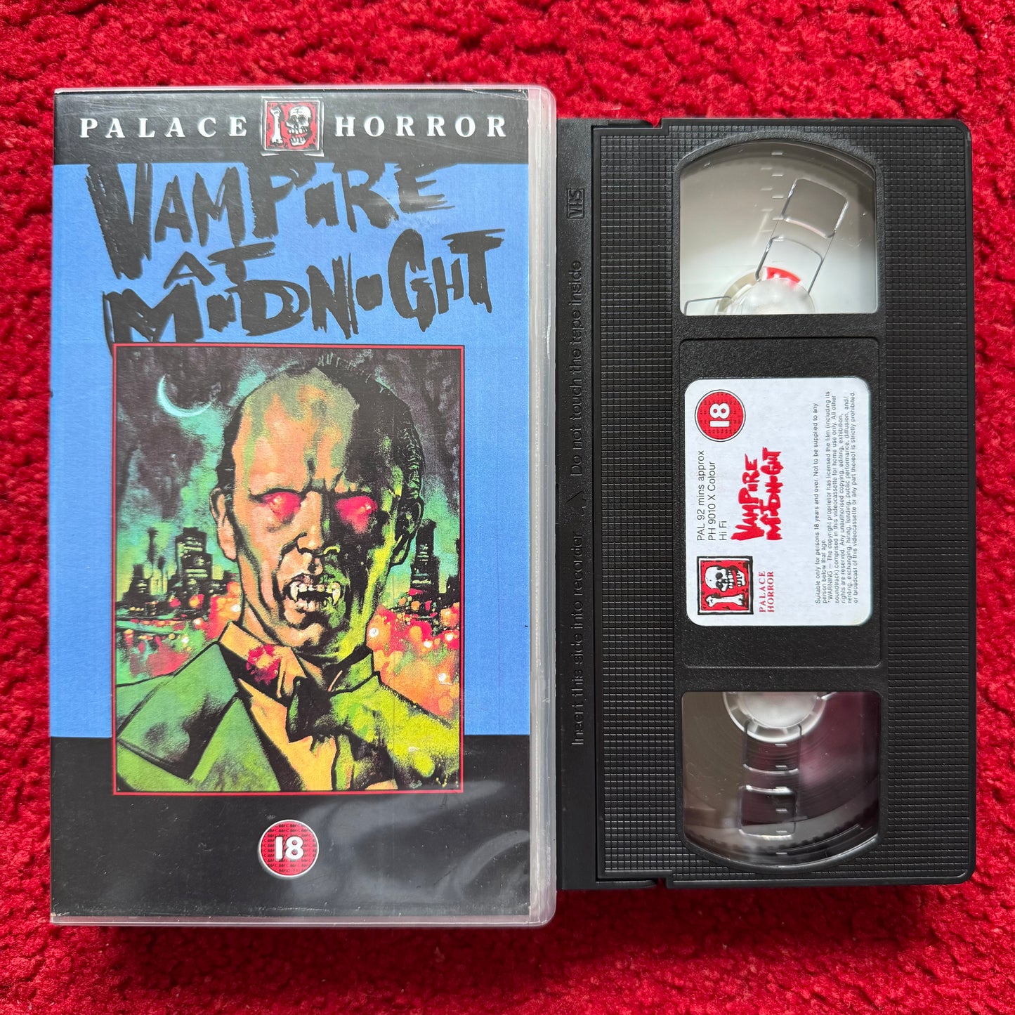 VHS tape of 'Vampire at Midnight' from Palace Horror on a red background