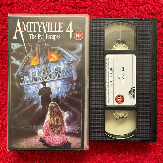 Amityville 4 VHS horror movie featuring a haunted house and eerie character on the cover