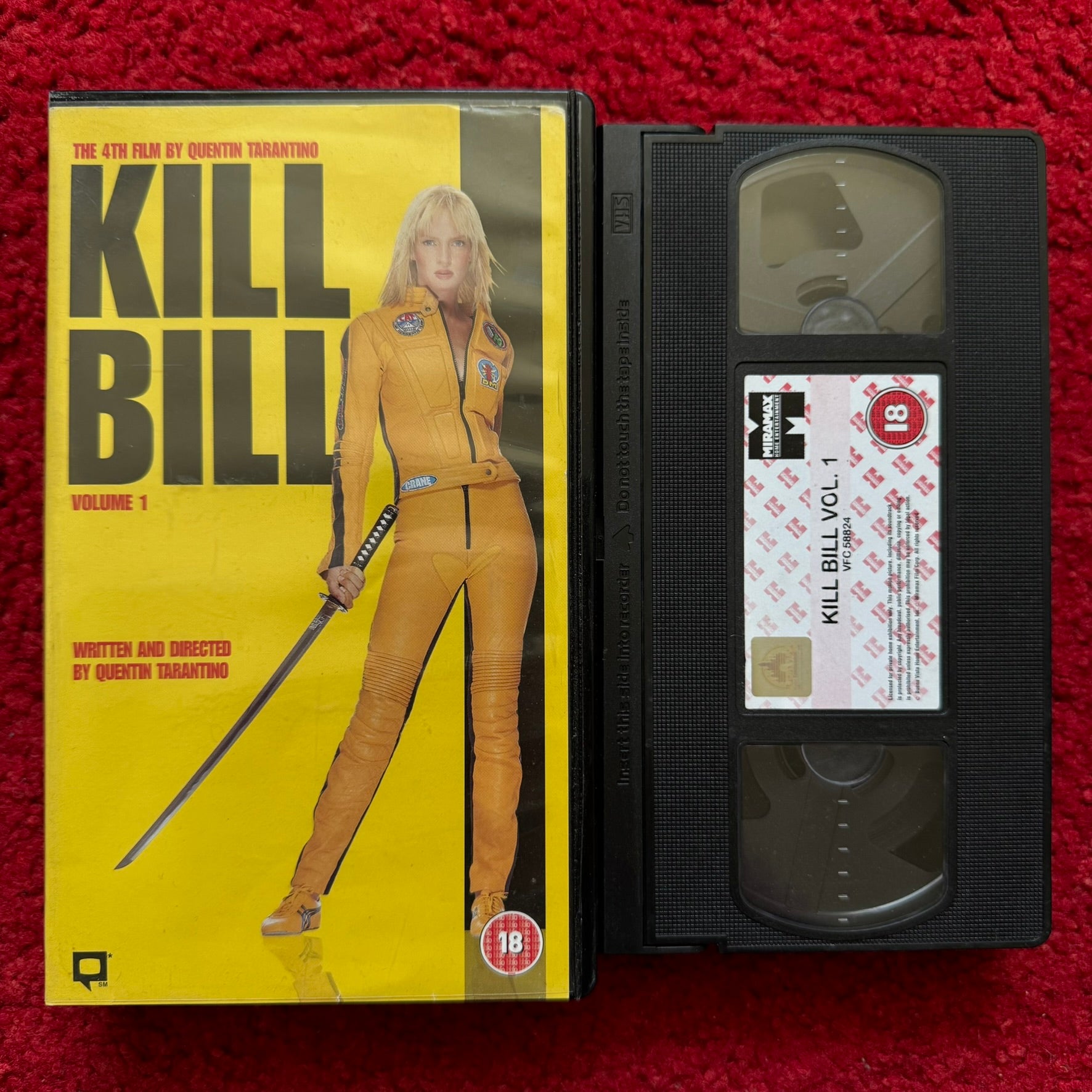 Kill Bill VHS Volume 1 featuring Uma Thurman with iconic yellow outfit and samurai sword