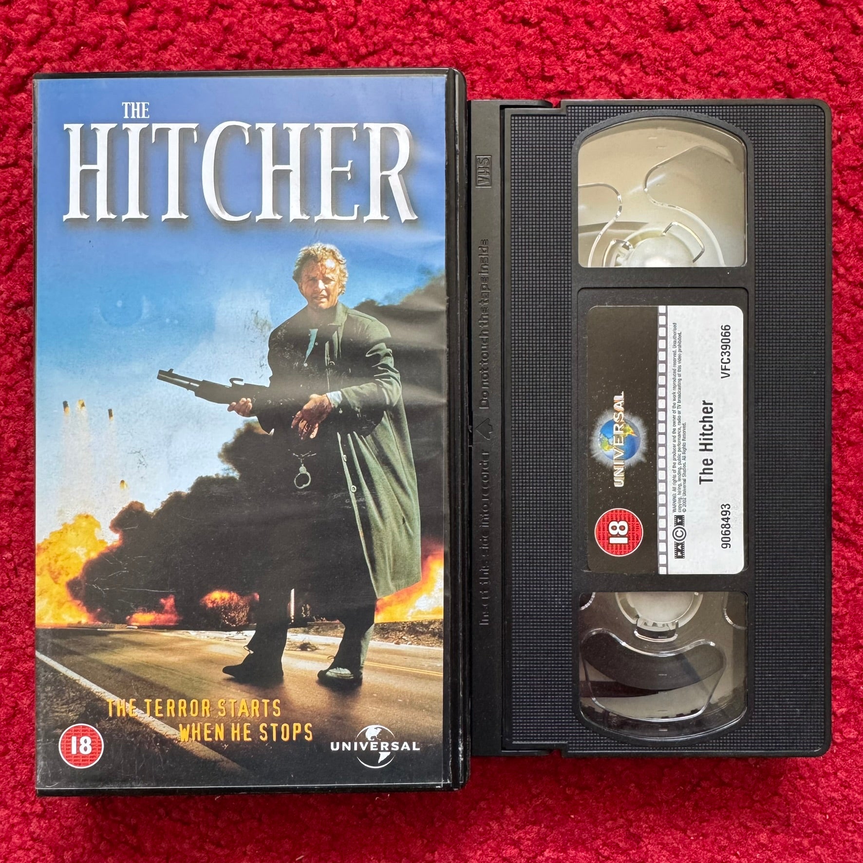 The Hitcher VHS featuring a suspenseful cover with intense imagery and bold title font