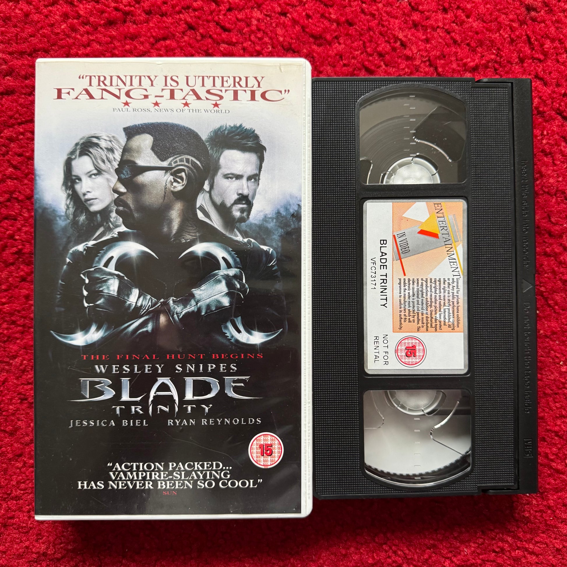 VHS tape of 'Blade Trinity' with movie poster on a red background