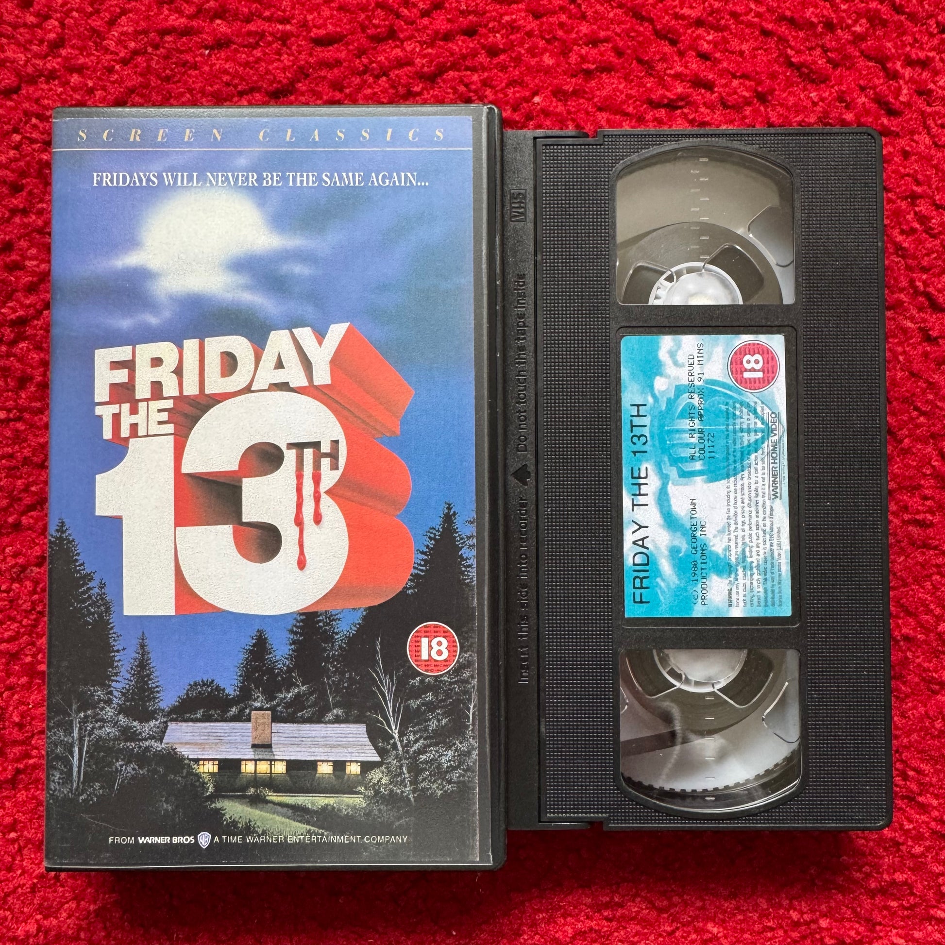 VHS tape of 'Friday the 13th' with cover on a red background