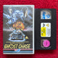 VHS tape of 'Ghost Chase' with cover on a red background