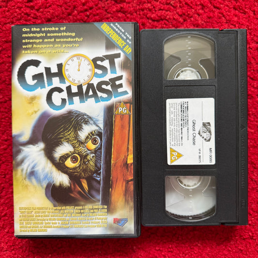 VHS tape of 'Ghost Chase' with cover on a red background