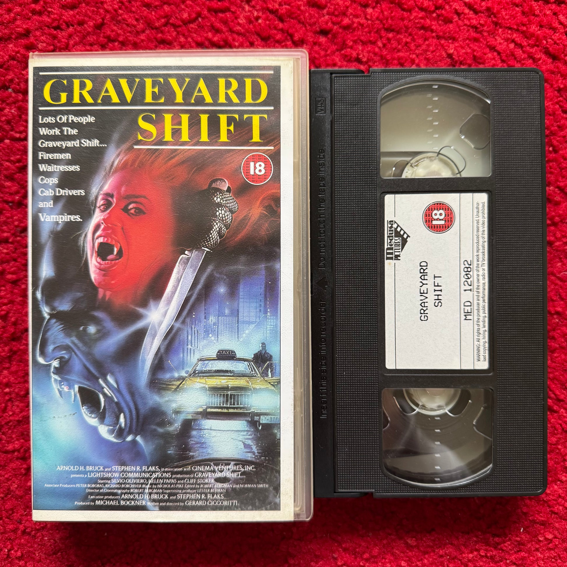VHS tape of 'Graveyard Shift' with cover on a red background