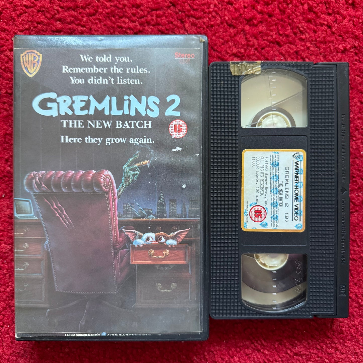 VHS tape of 'Gremlins 2: The New Batch' with cover on a red background