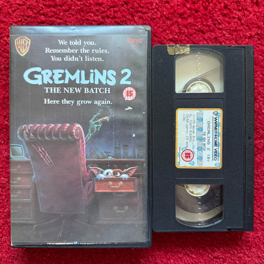 VHS tape of 'Gremlins 2: The New Batch' with cover on a red background