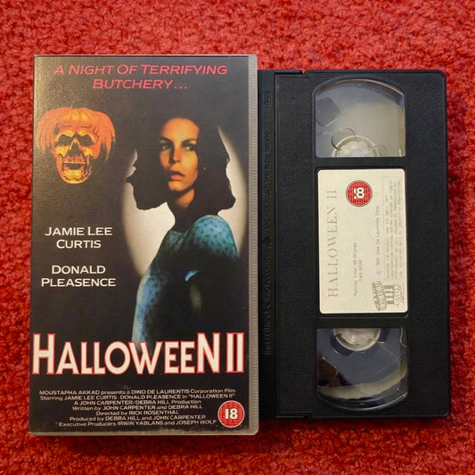 VHS tape of 'Halloween II' with cover featuring Jamie Lee Curtis on a red background