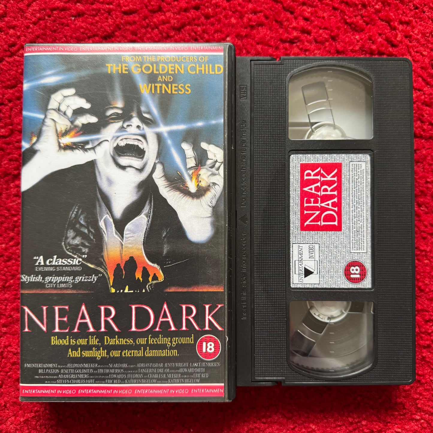 VHS tape of 'Near Dark' with cover on a red background