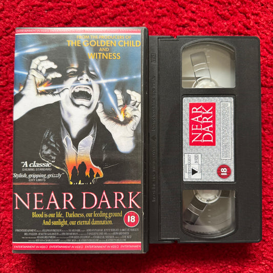 VHS tape of 'Near Dark' with cover on a red background