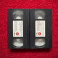 Two VHS tapes of 'Return of the Living Dead' and 'Night of the Living Dead' on a red background