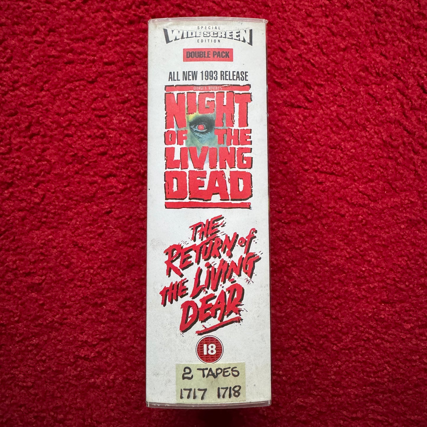 VHS tape box set of 'Night of the Living Dead' and 'The Return of the Living Dead' on a red background