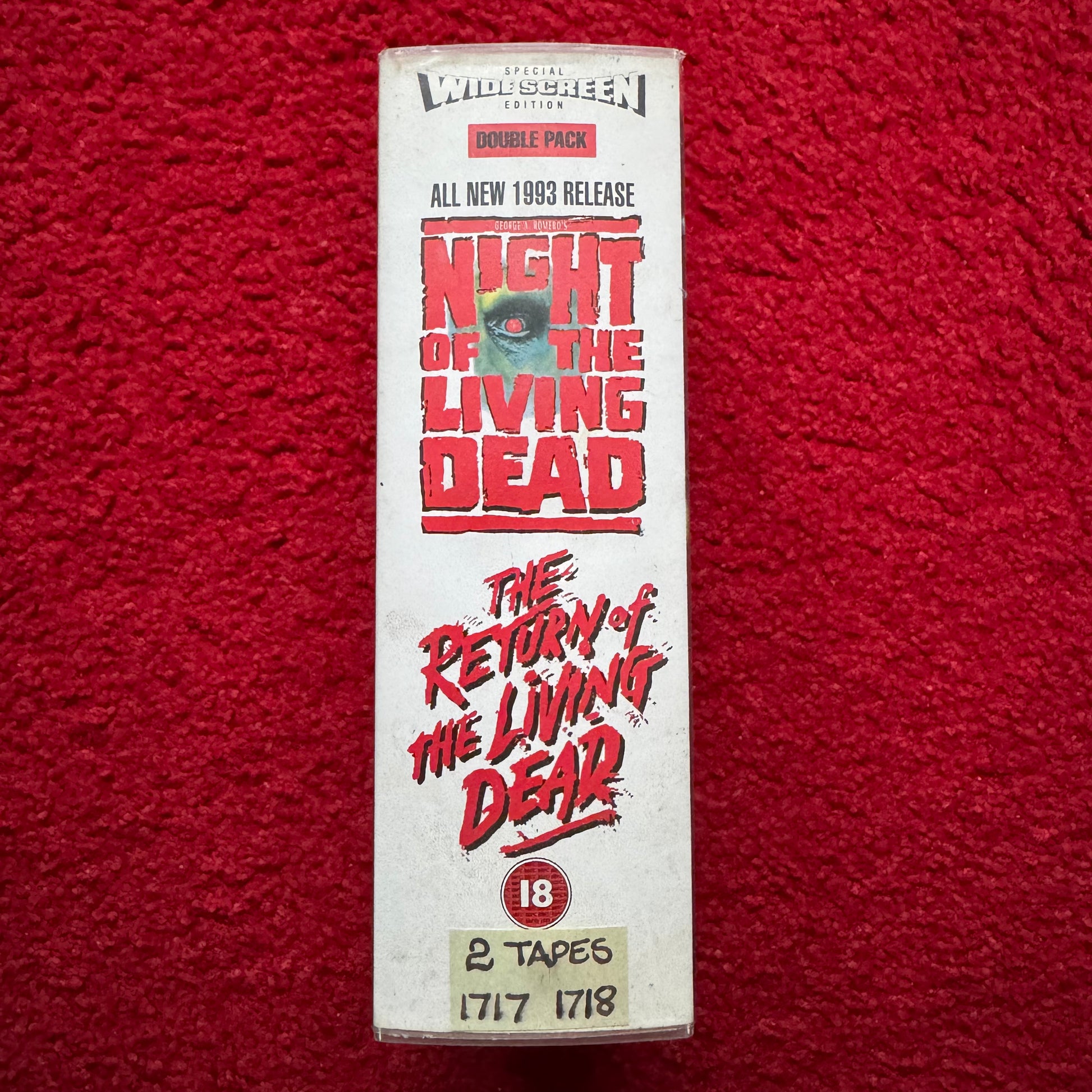 VHS tape box set of 'Night of the Living Dead' and 'The Return of the Living Dead' on a red background