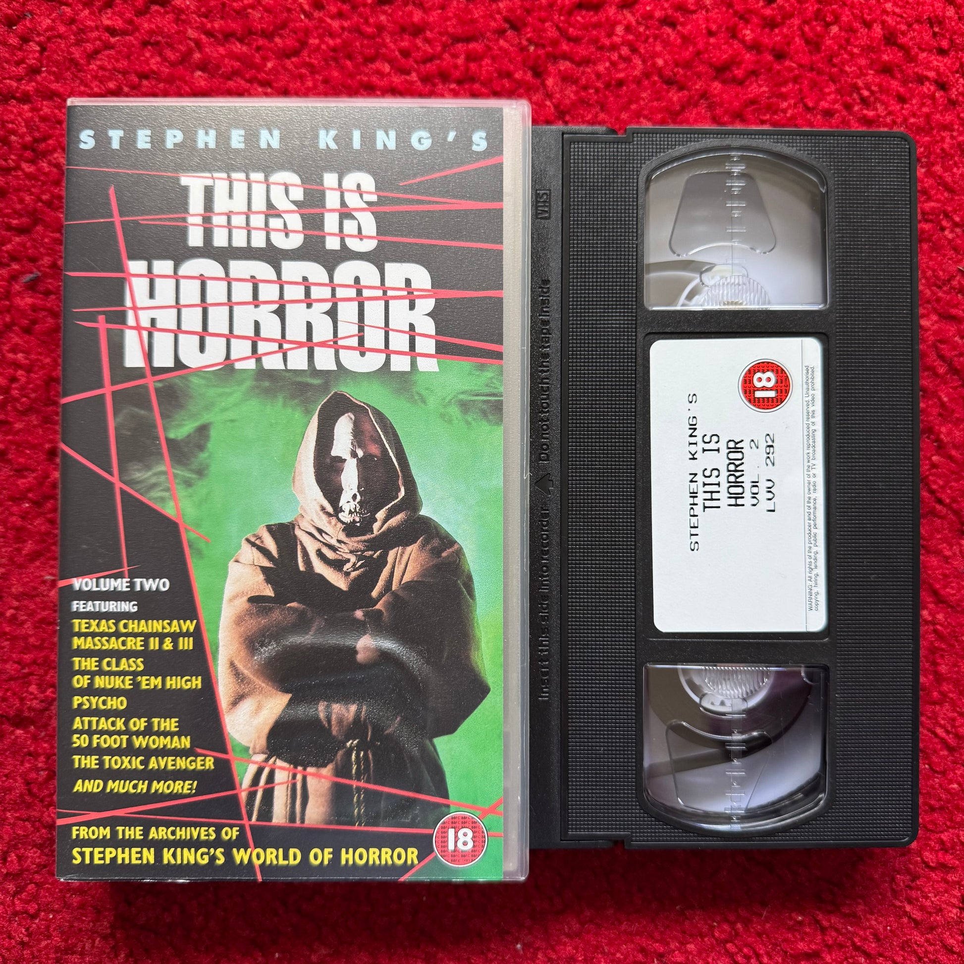 VHS tape of 'This Is Horror' with cover on a red background