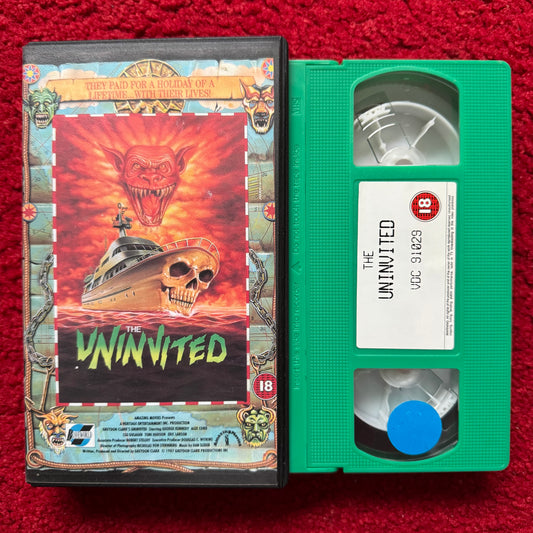 VHS tape of 'The Uninvited' with cover on a red background