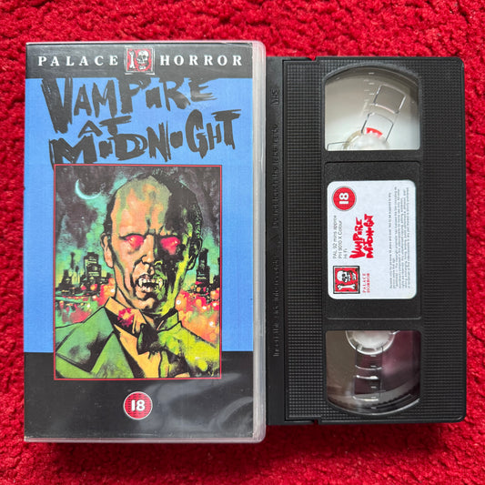 VHS tape of 'Vampire at Midnight' from Palace Horror on a red background